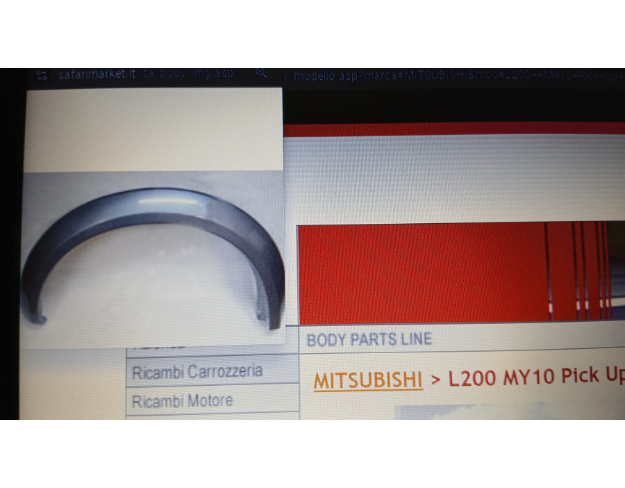 NDP07-12001 Parafanghino ant sx Mitsubishi L200 - Originale